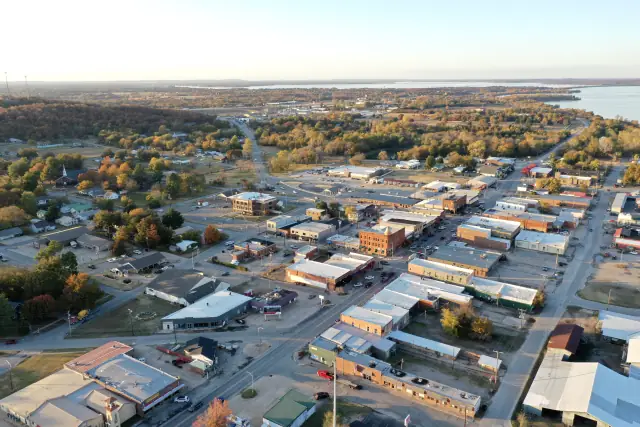 Downtown Eufaula from the air in fall, with the lake on the horizon