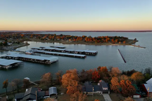 Eufaula Cove Marina from the air at dusk, with fall color along the shore