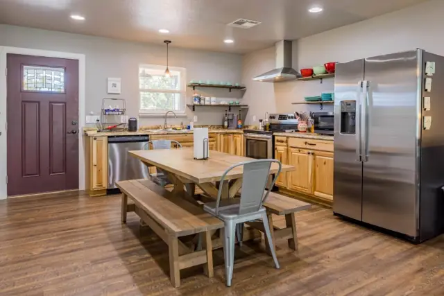 Fully stocked kitchen with farmhouse dining table