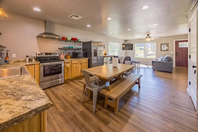Open floor plan with kitchen, dining, and living room
